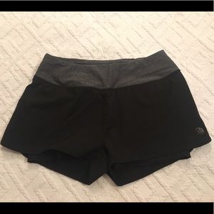 Black running shorts with grey and pink details